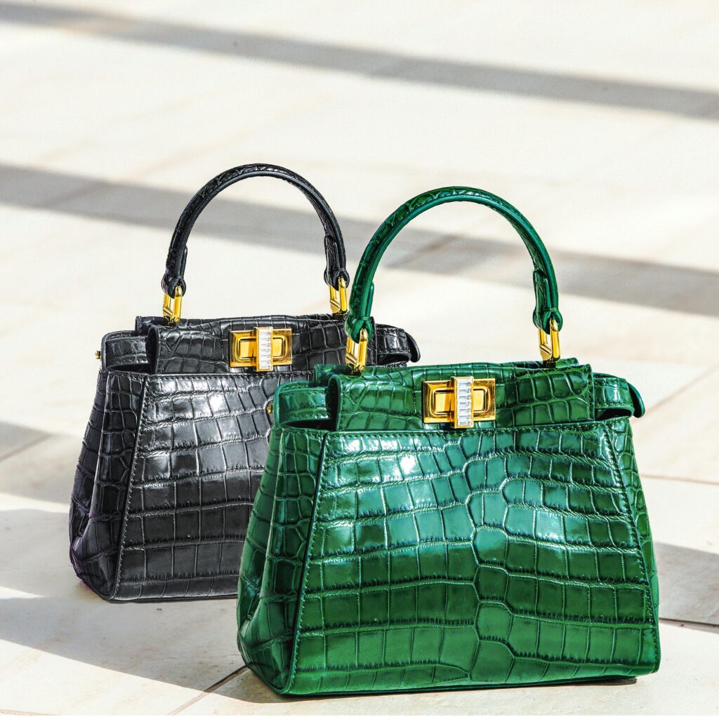 Elevate your style with these exquisite green and black crocodile pattern handbags, perfect for a luxury fashion statement.